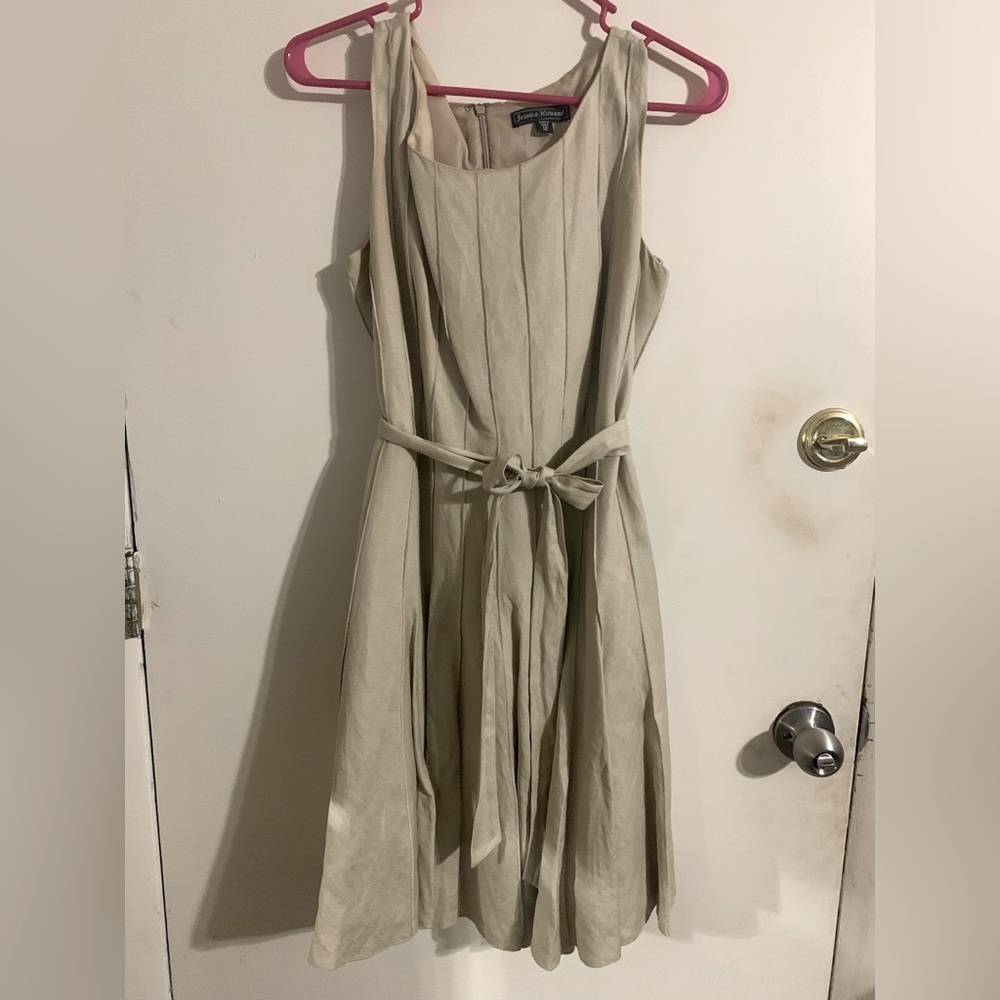 Jessica Howard, pleated, light brown knee length dress with tie belt.